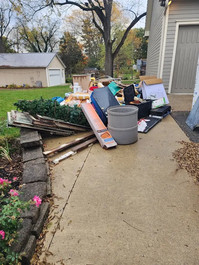 Dumpster being loaded with debris for 3 Yard Dumpster Rental in Mineral Wells
